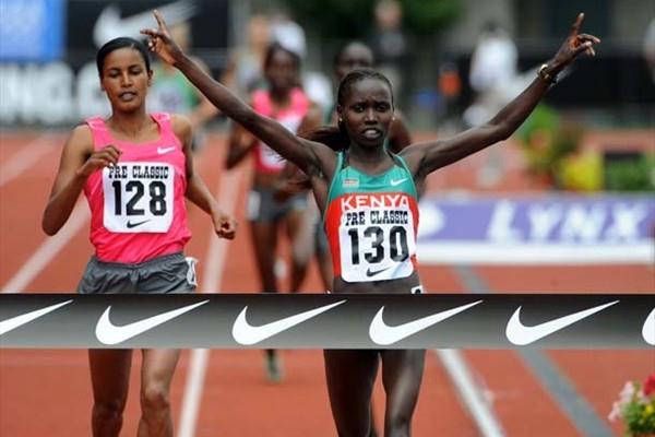 Vivian Cheruyiot (KEN) wins the 2000m at the 2009 Prefontaine Classic; in backround to left is World champion Jamal (Kirby Lee)
