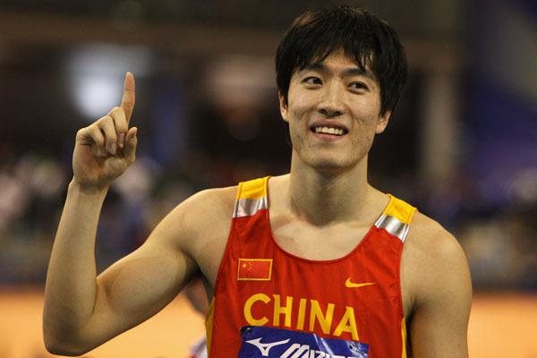 Liu Xiang celebrates his 60m hurdles victory (Getty Images)