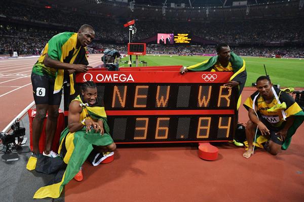 Winning Jamaican team: Usain Bolt, Yohan Blake, Michael Frater and Nesta Carter next to the clock showing the new world record of 36.84 in the Men's 4 x 100m Relay Final of the London 2012 Olympic Games on August 11, 2012  (Getty Images)
