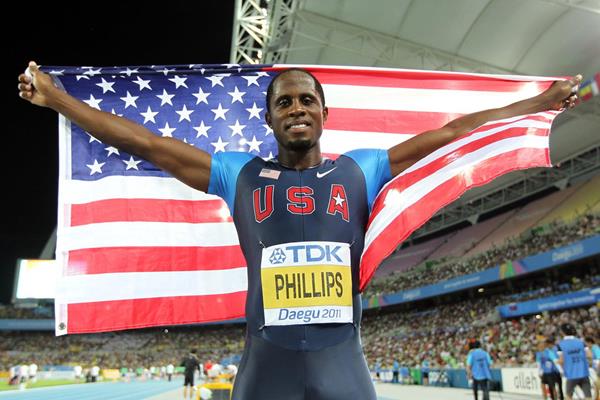 Dwight Phillips of the USA celebrates his fourth World Long Jump title (Getty Images)