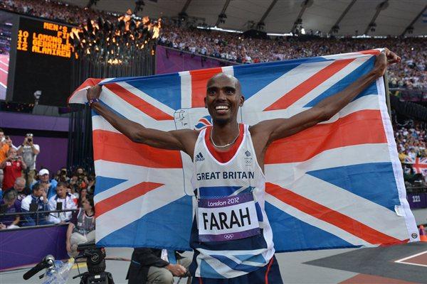 Mo Farah of Great Britain holds a Union flag as he celebrates winning gold in the Men's 5000m Final of the London 2012 Olympic Games (Getty Images)