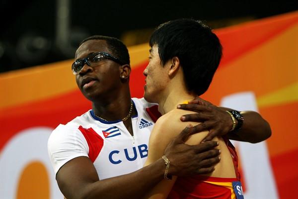 Dayron Robles of Cuba after his victory in the men's 60m Hurdles, hugs Liu Xiang of China the defending champion from China (Getty Images)