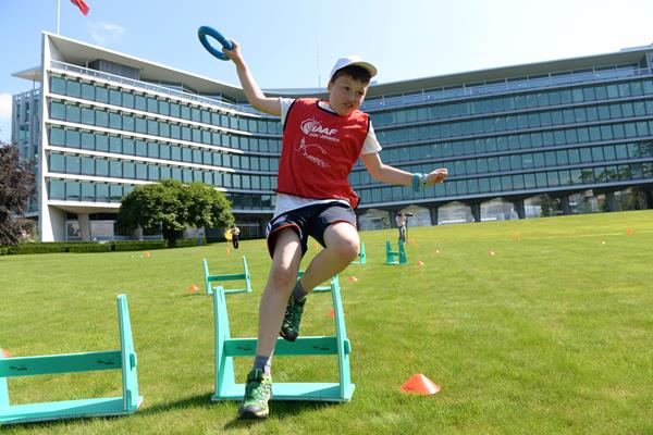 Children take part in the hurdles at the IAAF / Nestlé Kids’ Athletics demonstration in Vevey, Switzerland (Jiro Mochizuki)