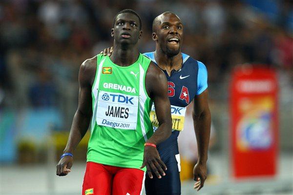 Kirani James (front) of Grenada and LaShawn Merritt of United States look to the scoreboard after finishing the men's 400 metres final during day four  (Getty Images)