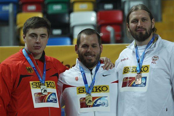 (L-R) Silver medalist David Storl of Germany, gold medalist Ryan Whiting of the United States and bronze medalist Tomasz Majewski of Poland stand on the podium during the medal ceremony for the Men's Shot Put during day one - WIC Istanbul (Getty Images)