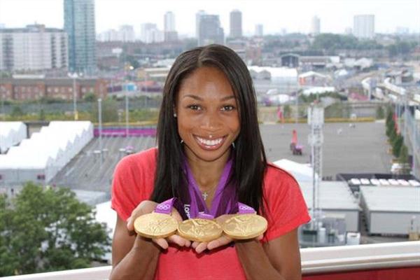 Allyson Felix with collection of London gold (Kirby Lee)