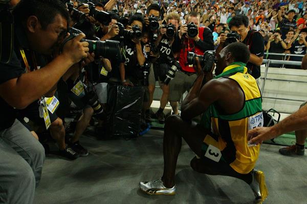 After winning gold in the 200m, Usain Bolt takes a picture of the photographers at the 2011 IAAF World Championships in Daegu (Getty Images)