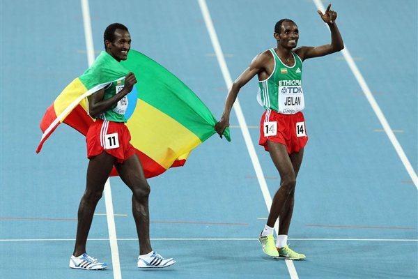 Ibrahim Jeilan (R) and Imane Merga of Ethiopia celebrate after the men's 10,000 metres final during day two (Getty Images)