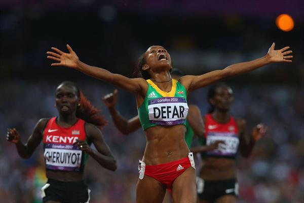 Meseret Defar of Ethiopia crosses the finish line and win gold in the Women's 5000m Final of the London 2012 Olympic Games on August 10, 2012 (Getty Images)