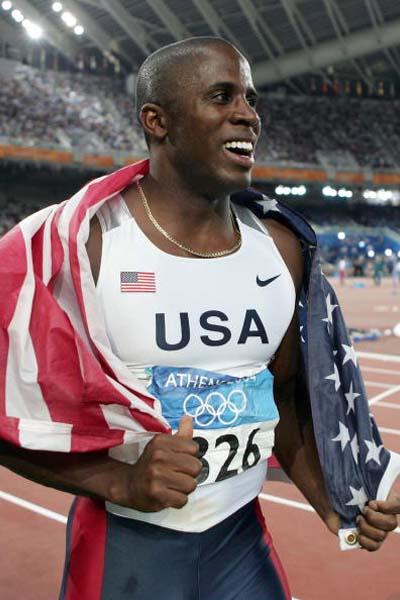Dwight Phillips of the US celebrates winning the Long Jump final (Getty Images)