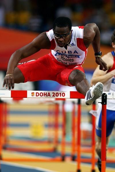 World record holder Dayron Robles of Cuba flies over a hurdle in the 60m hurdle heats in Doha (Getty Images)