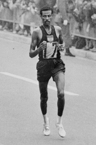 Abebe Bikila en route to his second Olympic Marathon title - Tokyo 1964 (Getty Images)