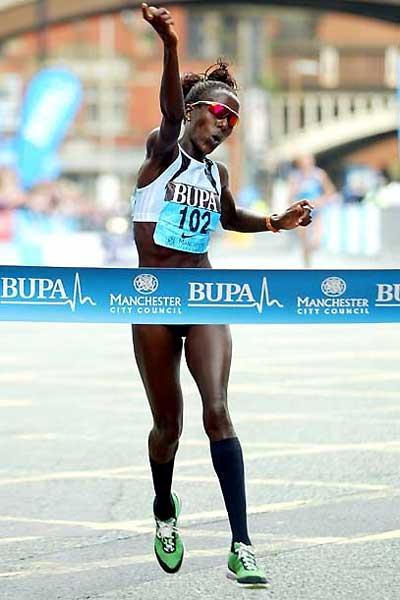 Lornah Kiplagat's jubliant celebration as she wins in Manchester (Mark Shearman)