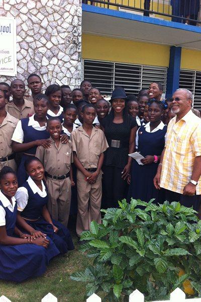 Veronica Campbell Brown (centre in hat) surrounded by students at St Andrew Technical while on a visit to Kingston in January 2012 (Veronica Campbell Brown)