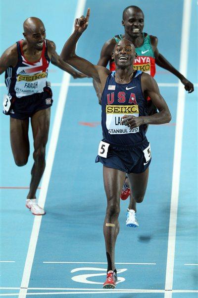 Bernard Lagat of the United States celebrates as crosses the line to win gold ahead of Mo Farah of Great Britain (L) and Edwin Sol of Kenya (R) in the Men’s 3000 Metres Final during day three - WIC Istanbul (Getty Images)