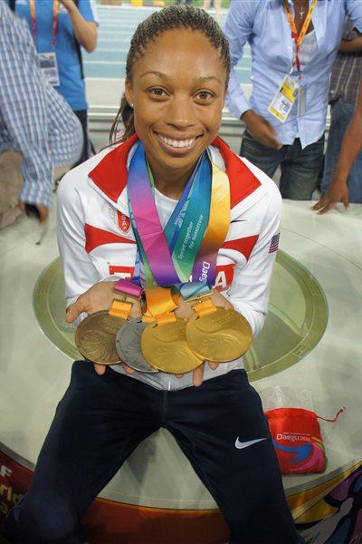 Allyson Felix in Daegu with the latest additions to her medal collection (Kirby Lee)