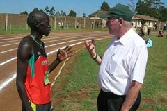 John Kemboi with his coach Colm O'Connell after winning the 5000m at the national high schools championships in Eldoret, Kenya. (David Macharia)