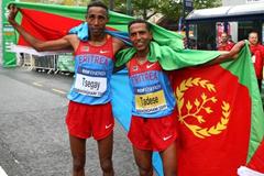 Eritrea's Samuel Tsegay and Zersenay Tadese celebrate their team silver in Birmingham (Getty Images)