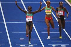 Vivian Cheruiyot of Kenya crosses the line to win the gold medal in the women's 5000m final at the 12th IAAF World Championships in Athletics (Getty Images)