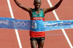 Samuel Wanjiru crosses the line in an Olympic record of 2:06:32 after leading the marathon for most of the way (Getty Images)