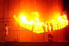 Sinagpore's Darren Choy, twice world champion sailor, lighting the cauldron at the opening ceremony of the Singapore 2010 Youth Olympic Games (YOG) at The Float@Marina Bay (SPH-SYOGOC / Bryan van der Beek)