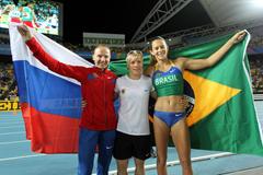 Svetlana Feofanova of Russia, Martina Strutz of Germany and Fabiana Murer of Brazil celebrate after the women's pole vault final  (Getty Images)