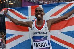 Mo Farah of Great Britain holds a Union flag as he celebrates winning gold in the Men's 5000m Final of the London 2012 Olympic Games (Getty Images)
