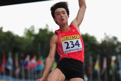 Qing Lin of China wins the boys' long jump final in Lille (Getty Images)