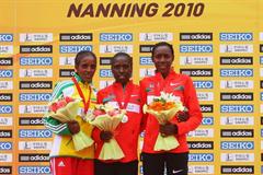 The women's podium in Nanning - runner-up Dire Tune (ETH), champion Florence Kiplagat (KEN), and bronze medallist Peninah Arusei (KEN) (Getty Images)