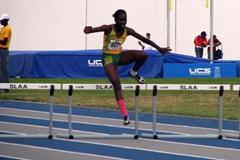 Janieve Russell (JAM) closes out a CARIFTA 300m Hurdles record (Anthony Debeauville)