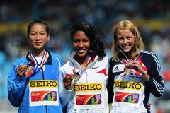 Gold medalist Ajee Wilson (USA) (c)  with Jessica Judd (GBR) (r) and silver medal winner Chunyu WANG (CHN) (l) after the Girls 800 metres final - Day Five - WYC Lille 2011 (Getty Images)