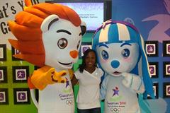 Jamaica's double Olympic 200m champion Veronica Campbell Brown sandwiched between the mascots for the Singapore Youth Olympics, taken while in Singapore (c)