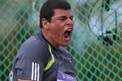 Eslam Ibrahim of Egypt reacts in the boys hammer throw qualification at the 2010 Youth Olympic Games in Singapore (XINHUA/ SYOGOC-POOL/ Meng Yongmin)