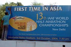 Signboard in New Delhi is cleaned in preparation for the 2004 World Half Marathon (AFP/Getty Images)