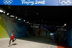 Eventual winner Samuel Wanjiru enters the stadium at the end of the Olympic marathon (Getty Images)