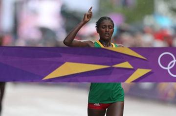 Tiki Gelana of Ethiopia celebrates as she crosses the finish line to win the gold medal in the Women's Marathon at The Mall on Day 9 of the London 2012 Olympic Games on August 5, 2012 (Getty Images)