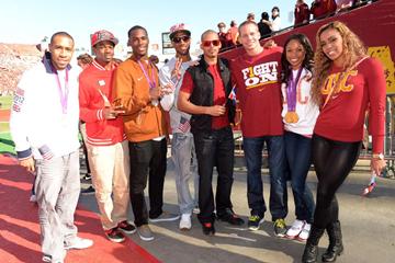 Allyson Felix (2nd from right) with fellow Olympians at the USC Homecoming football game