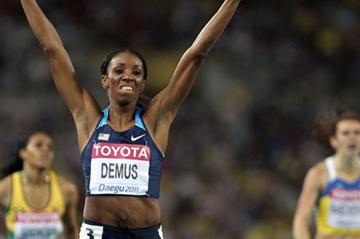 Lashinda Demus of United States celerates with her country's flag after claiming gold in the women's 400 metres hurdles final during day six (Getty Images)