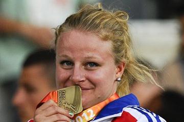 Alexandra Tavernier of France poses with her medal on the podium during the medals ceremony of the Women's Hammer Throw Final on the day five of the 14th IAAF World Junior Championships in Barcelona on 14 July 2012 (Getty Images)