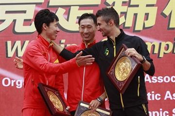 2010 Race Walking Challenge Final men's podium (l to r) - runner-up Chu Yafei (CHN), race winner Zhen Wang (CHN), and Giorgio Rubino (ITA) (organisers)