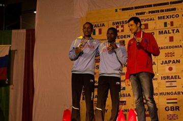 Men's podium at Ponte di Legno, from left: silver medallist Azeria Teklay, winner Petro Mamo, and bronze medallist Andrey Safranov (RUS) (WMRA)