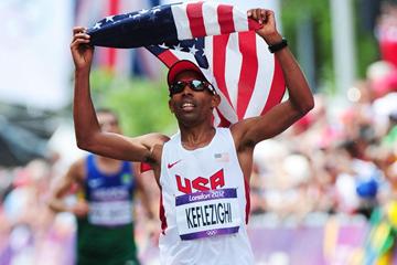 Mebrahtom Keflezighi of the United States holds the United States' national flag aloft as he approaches the finish line in the Men's Marathon of the London 2012 Olympic Games. (Getty Images)