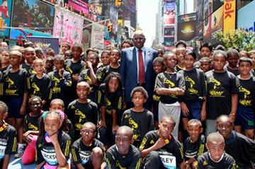 IAAF President Lamine Diack and 100 kids celebrate the IAAF Centenary in New York's Times Square (Victah Sailer)