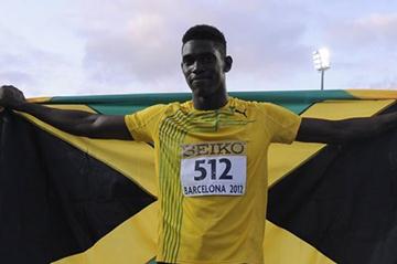 Fedrick Dacres of Jamaica celebrates after winning the gold medal on the Men's Discus Throw Final on the day three of the 14th IAAF World Junior Championships in Barcelona on 12 July 2102 (Getty Images)