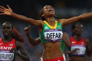 Meseret Defar of Ethiopia crosses the finish line and win gold in the Women's 5000m Final of the London 2012 Olympic Games on August 10, 2012 (Getty Images)