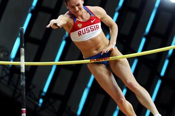 World record holder Elena Isinbaeva of Russia in flight during the women's pole vault (Getty Images)