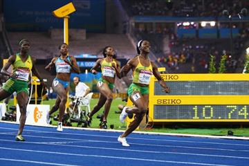 Shelly-Ann Fraser of Jamaica crosses the line to celebrates winning the women's 100m gold medal at the 12th IAAF World Championships in Athletics (Getty Images)