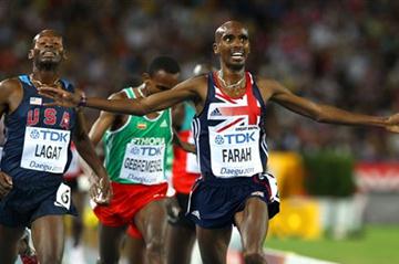 Mohamed Farah of Great Britain celebrates as he crosses the finish line ahead of Bernard Lagat of the USA to claim victory in the men's 5000 metres final (Getty Images)
