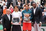 Usain Bolt presents Rafael Nadal with his trophy at the 2013 French Open (Getty Images)