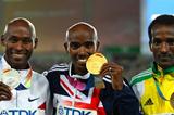  Mohamed Farah of Great Britain celebrates with his gold medal , Bernard Lagat of the USA the silver and Dejen Gebremeskel of Ethiopia the bronze, during the medal ceremony for the men's 5000 metres final  (Getty Images)